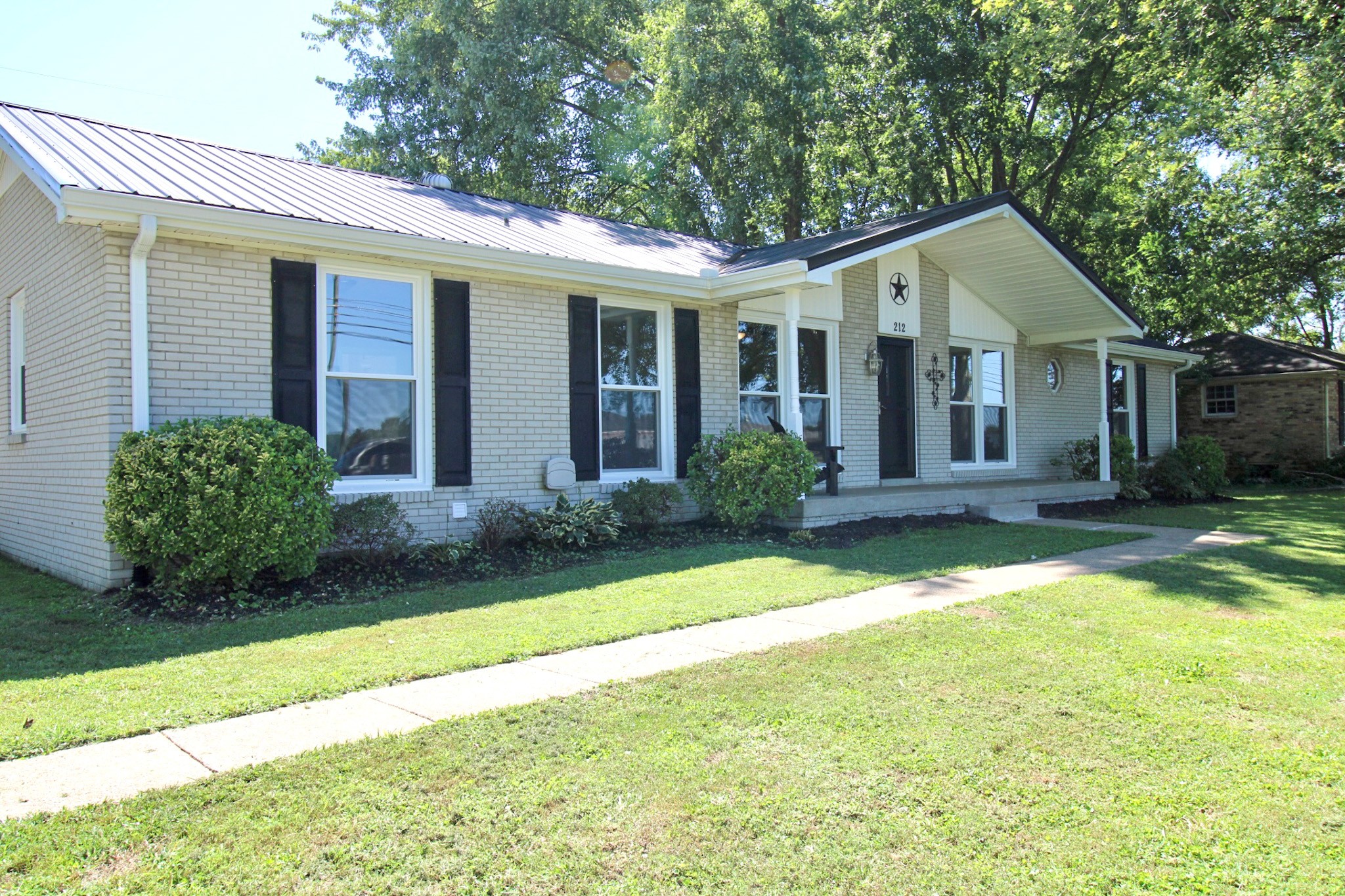 212 Cunningham Lane Clarksville, TN 37042 - Photo 2 of 19 a front view of a house with a yard