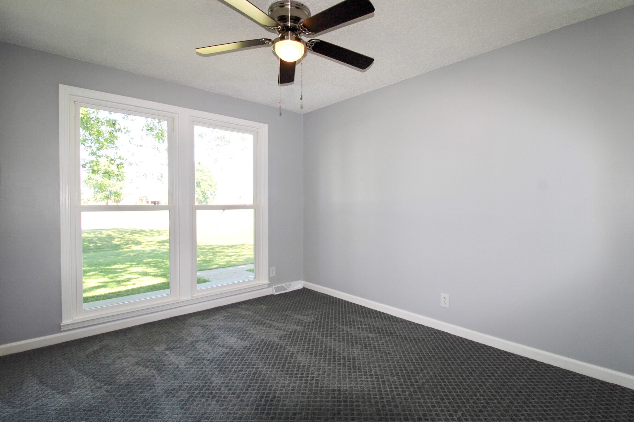 212 Cunningham Lane Clarksville, TN 37042 - Photo 11 of 19 an empty room with a window and a fan