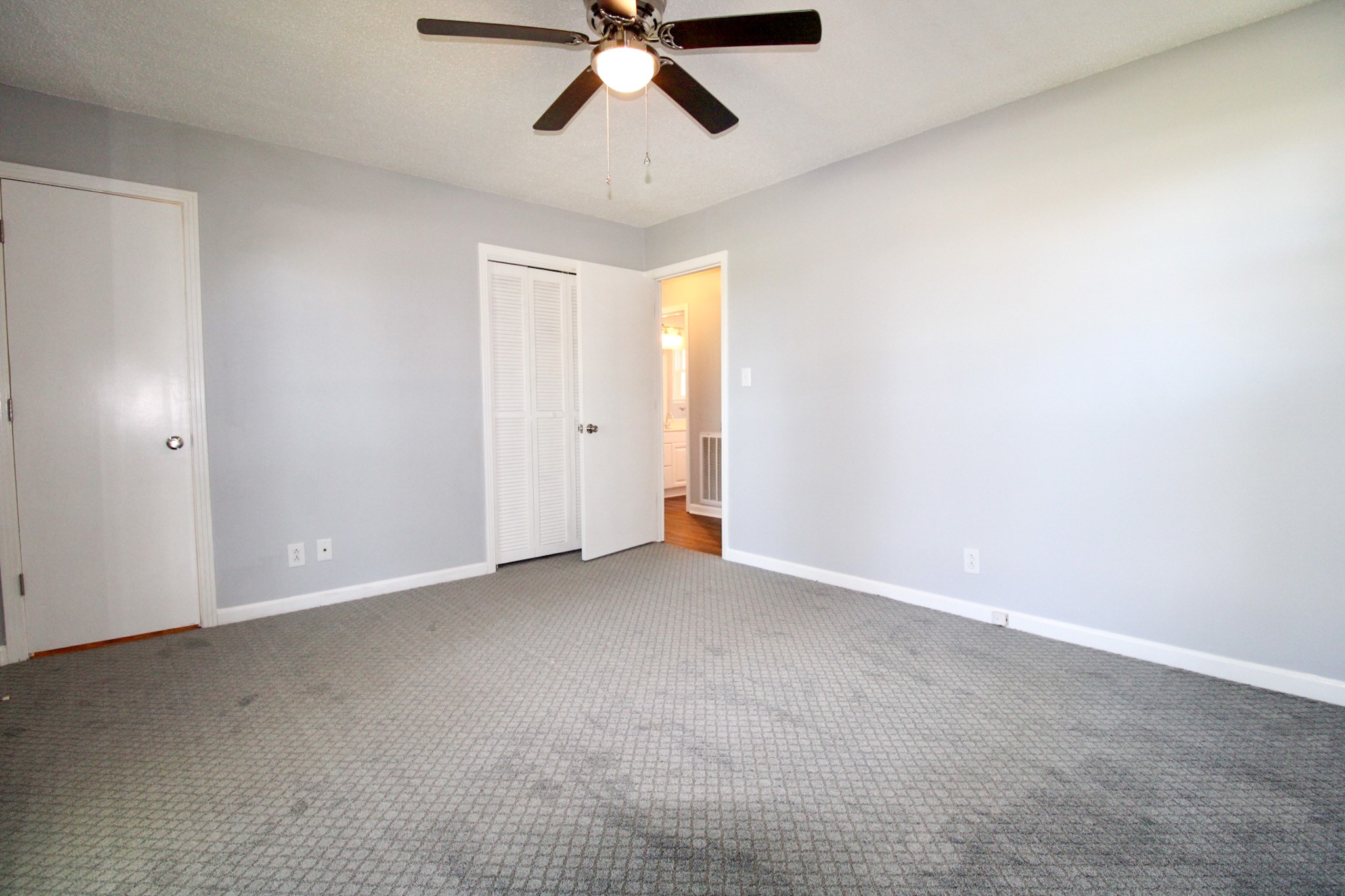 212 Cunningham Lane Clarksville, TN 37042 - Photo 14 of 19 an empty room with a ceiling fan and window
