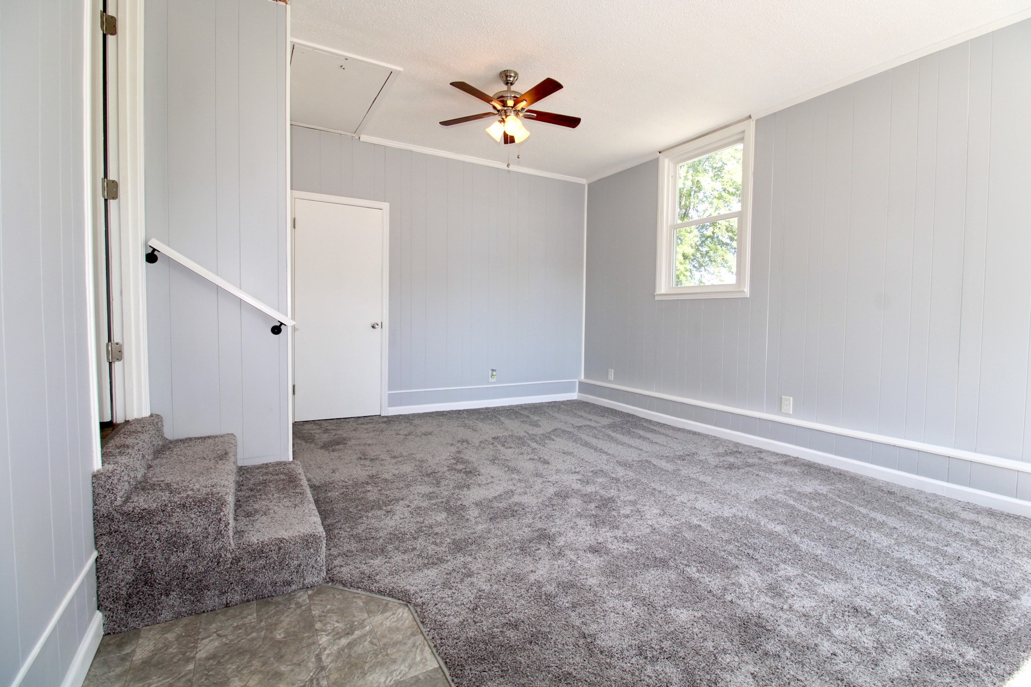 212 Cunningham Lane Clarksville, TN 37042 - Photo 17 of 19 a view of a livingroom with a ceiling fan and window