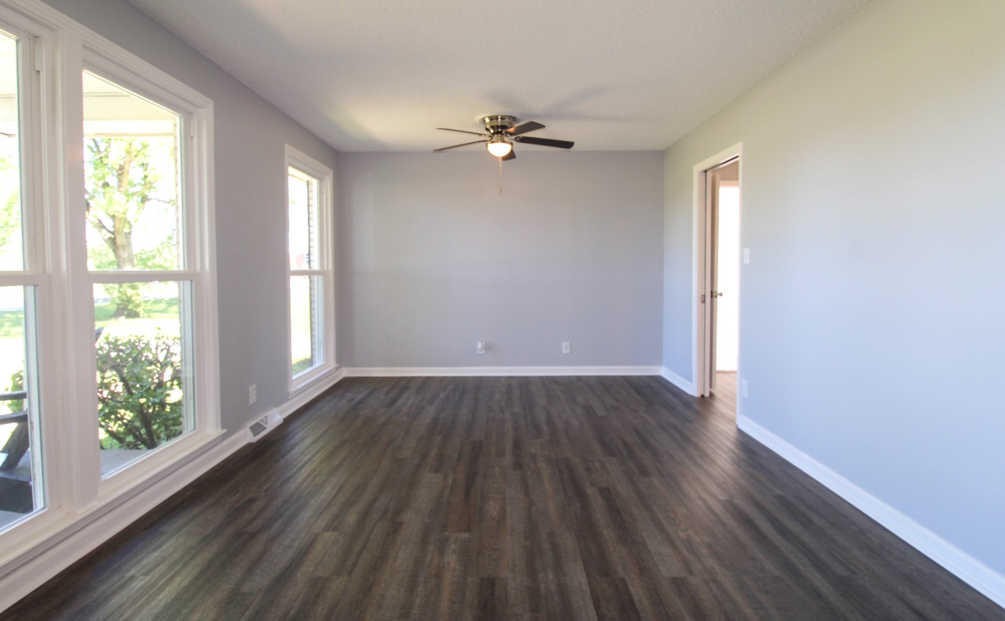 212 Cunningham Lane Clarksville, TN 37042 - Photo 5 of 19 a view of a livingroom with wooden floor and a window