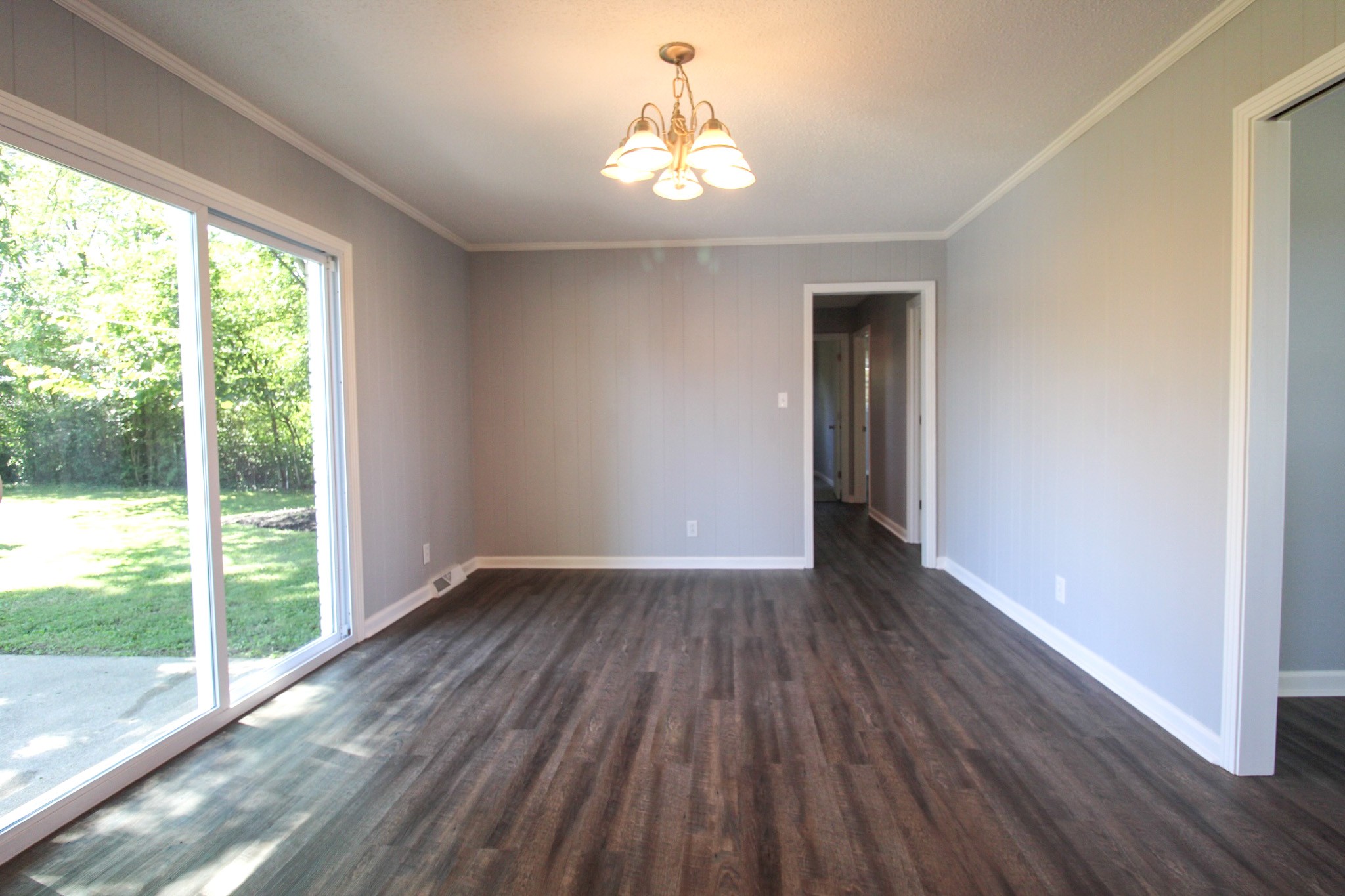 212 Cunningham Lane Clarksville, TN 37042 - Photo 9 of 19 a view of an empty room with wooden floor and a window