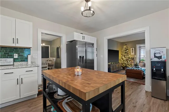 a view of a dining room with furniture and chandelier