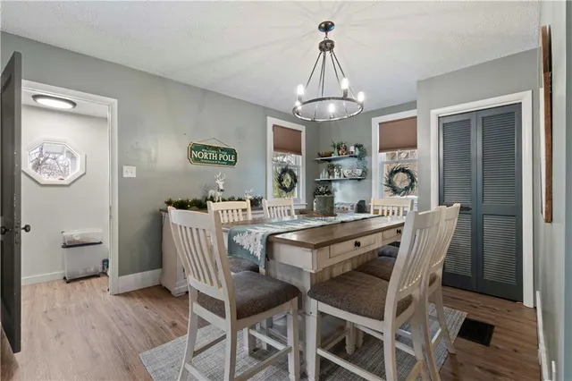 a bedroom with a large bed and a tv on the dresser