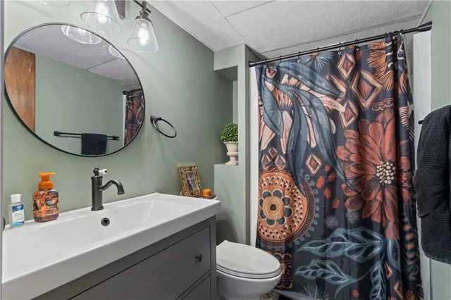 a outdoor space with patio fireplace couches and a dining table with garden view