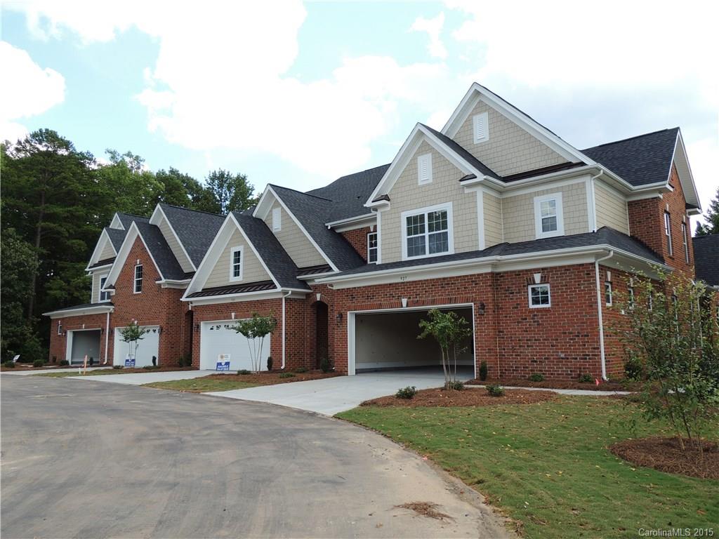925 Ospre Lane, Unit 162 Fort Mill, SC 29708 - Photo 3 of 22 a front view of a house with a yard and garage