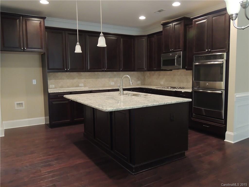 925 Ospre Lane, Unit 162 Fort Mill, SC 29708 - Photo 9 of 22 a kitchen with stainless steel appliances granite countertop a refrigerator and a sink