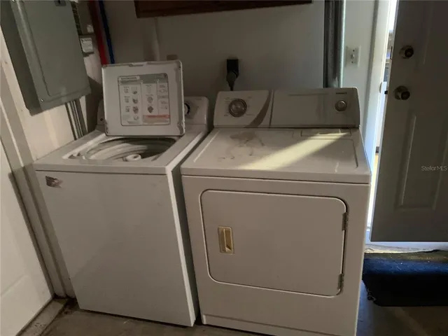 a view of a hallway with a chandelier