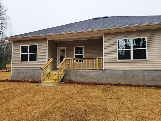 a front view of a house with glass windows