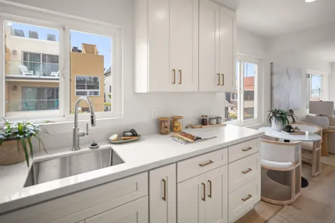 a kitchen with a table and chairs