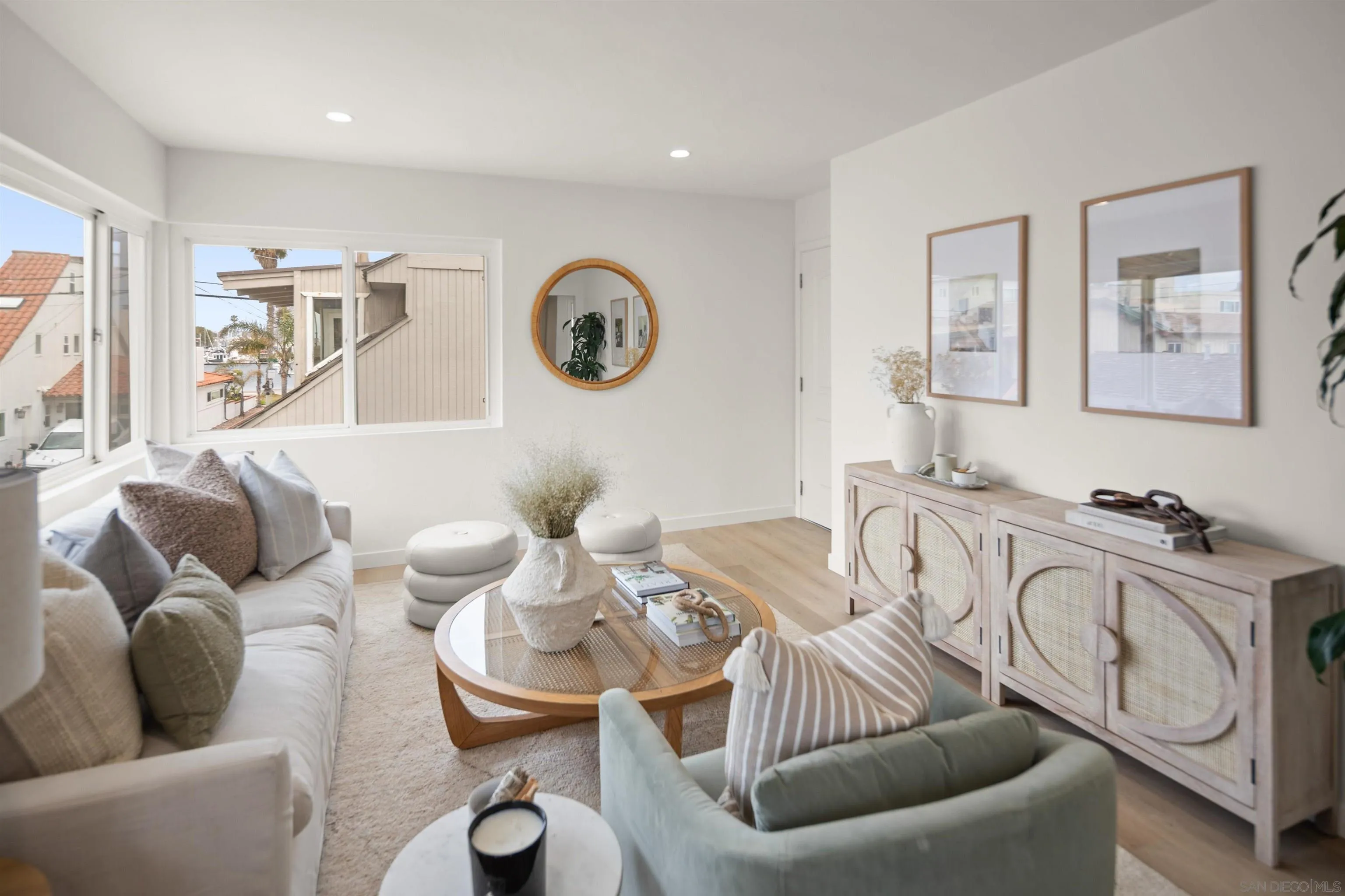 801-809 Liverpool Court San Diego, CA 92109 - Photo 13 of 24 a living room with furniture and a large window