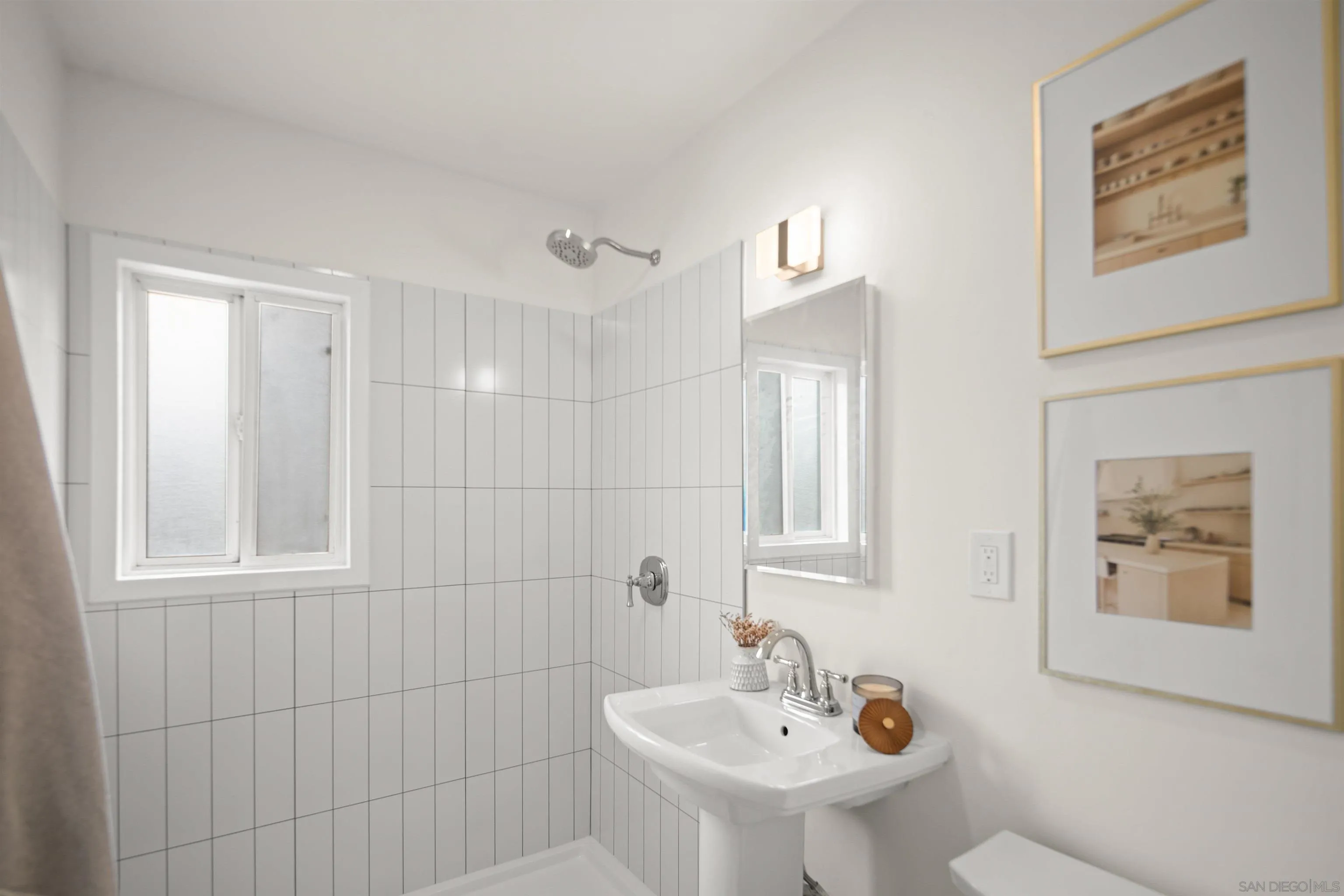 801-809 Liverpool Court San Diego, CA 92109 - Photo 17 of 24 a bathroom with a sink a mirror and a shower