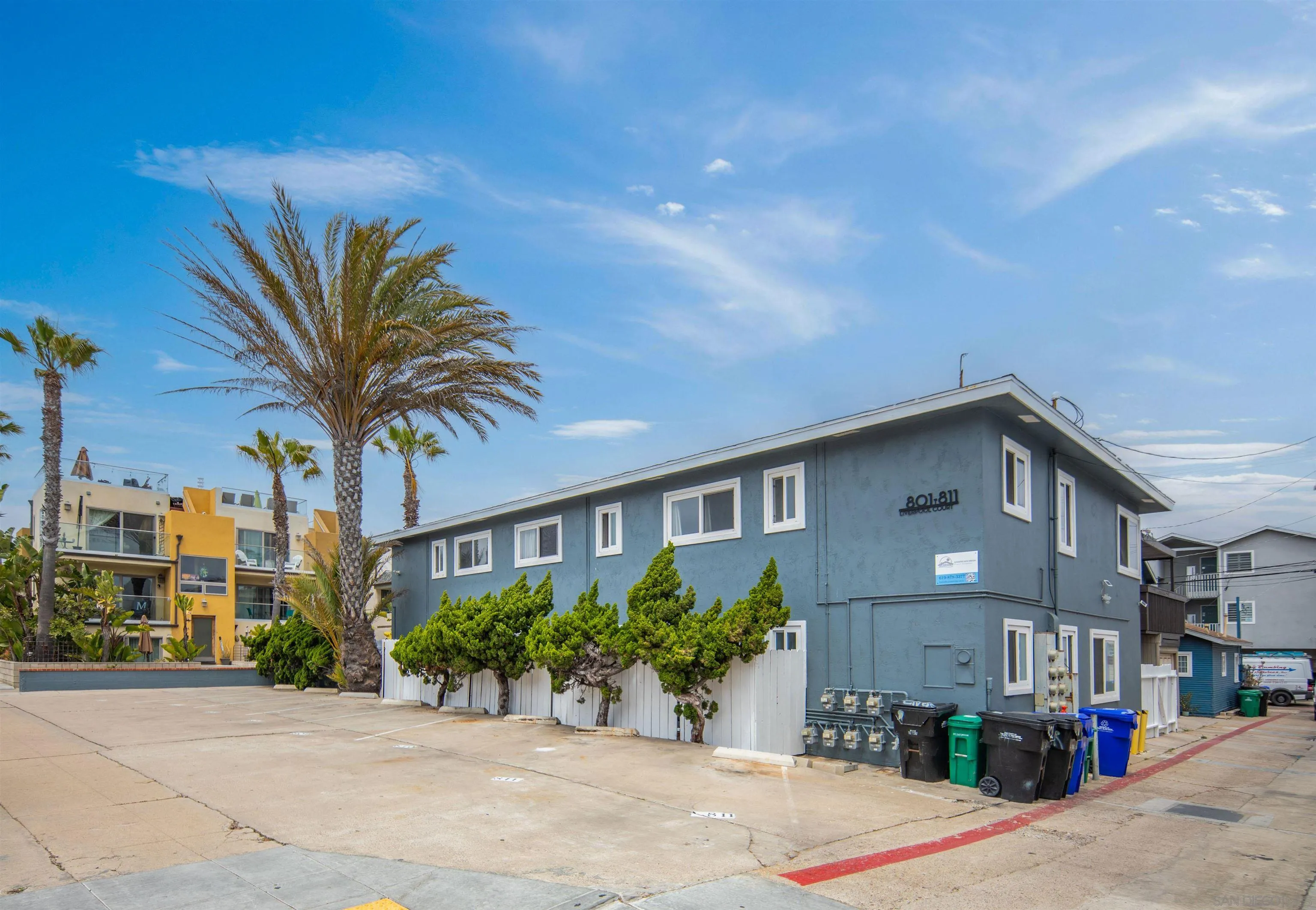 801-809 Liverpool Court San Diego, CA 92109 - Photo 5 of 24 a front view of a house with a yard