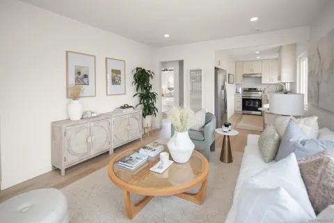 a kitchen with a refrigerator and a white cabinets