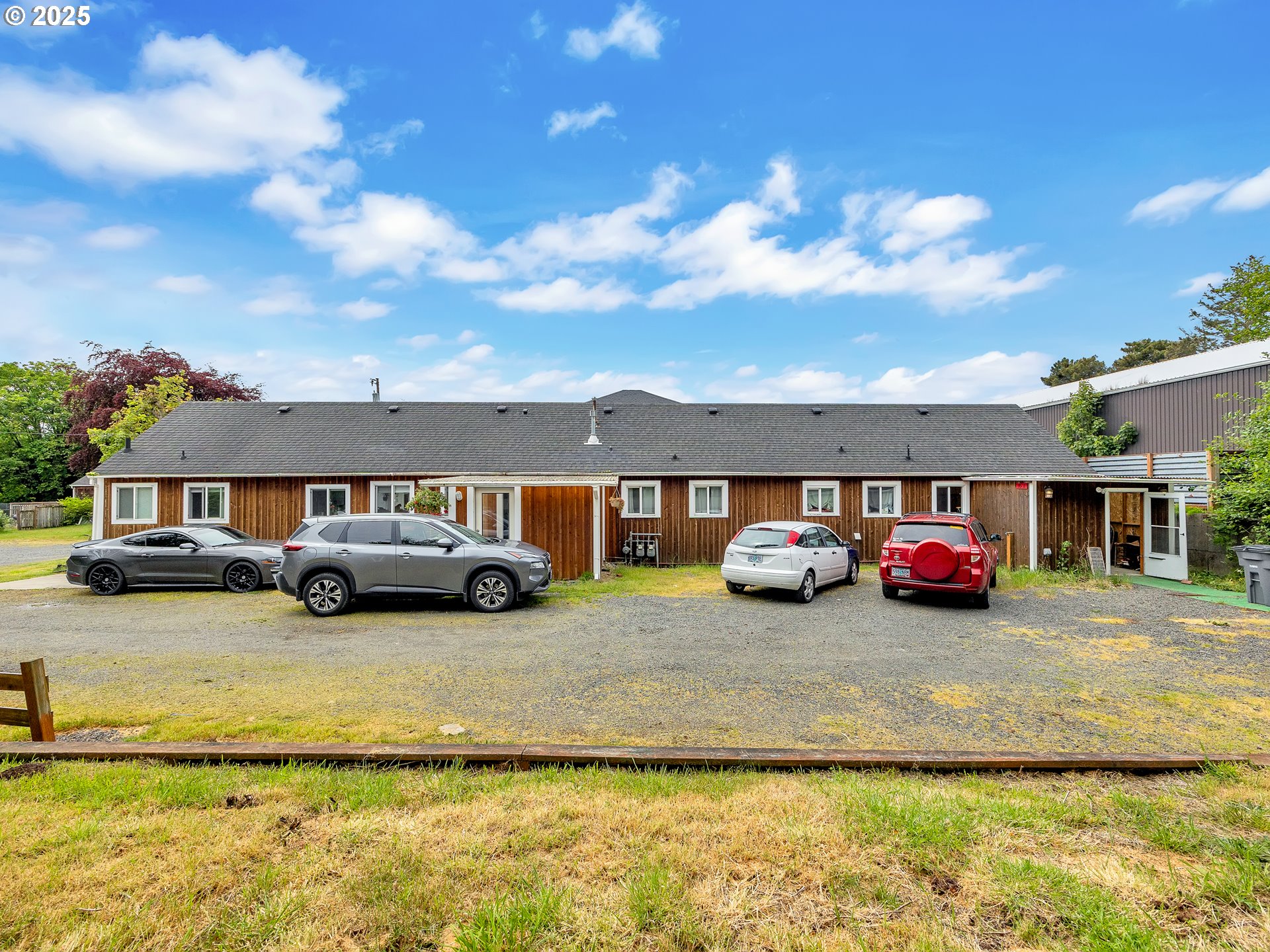 3379 North Highway 101 Warrenton, OR 97146 - Photo 11 of 34 a view of a house with swimming pool and a yard