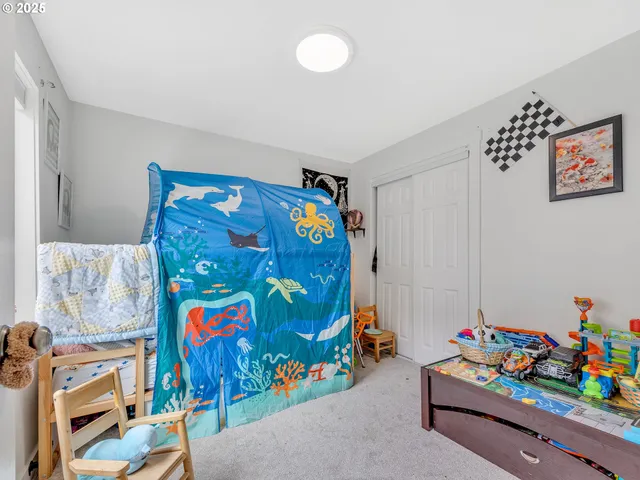 a room with toys and wall picture