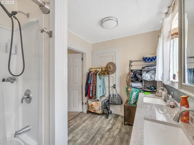 a bedroom with bed and a chandelier