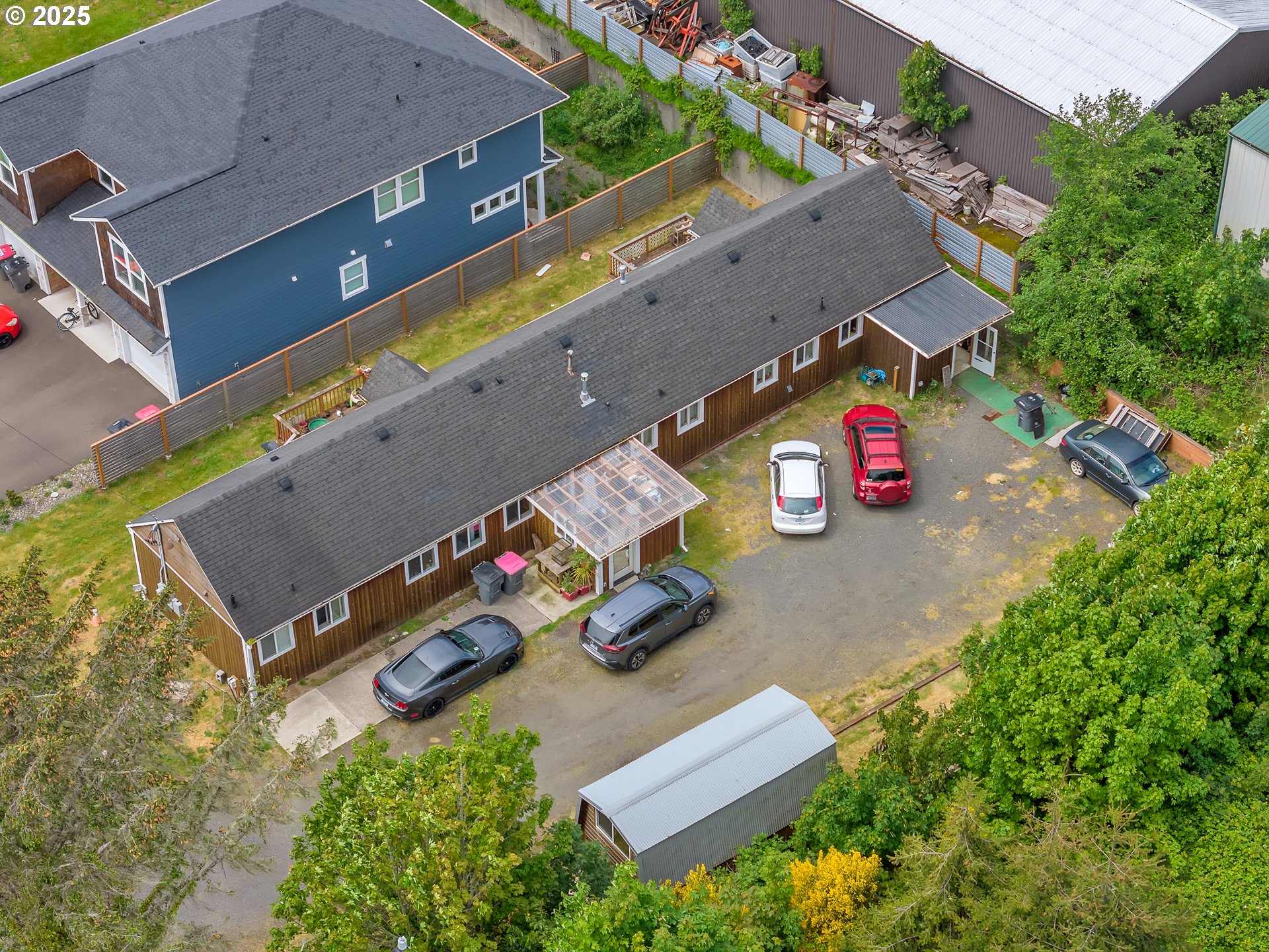 3379 North Highway 101 Warrenton, OR 97146 - Photo 7 of 34 an aerial view of a tennis ground and a cars park