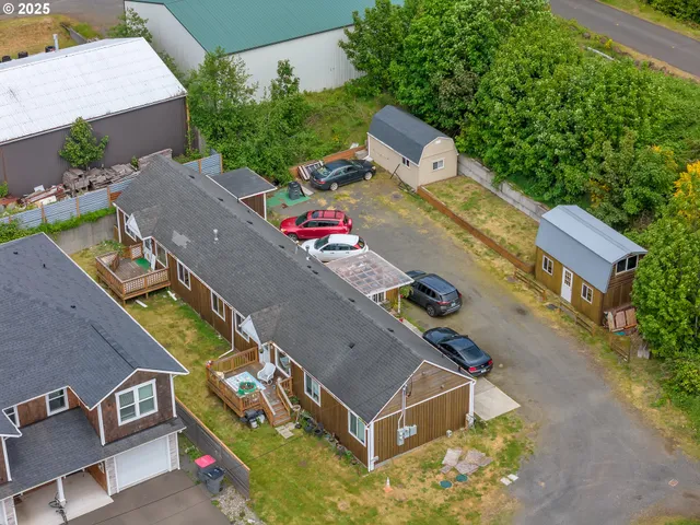 an aerial view of a house with a swimming pool