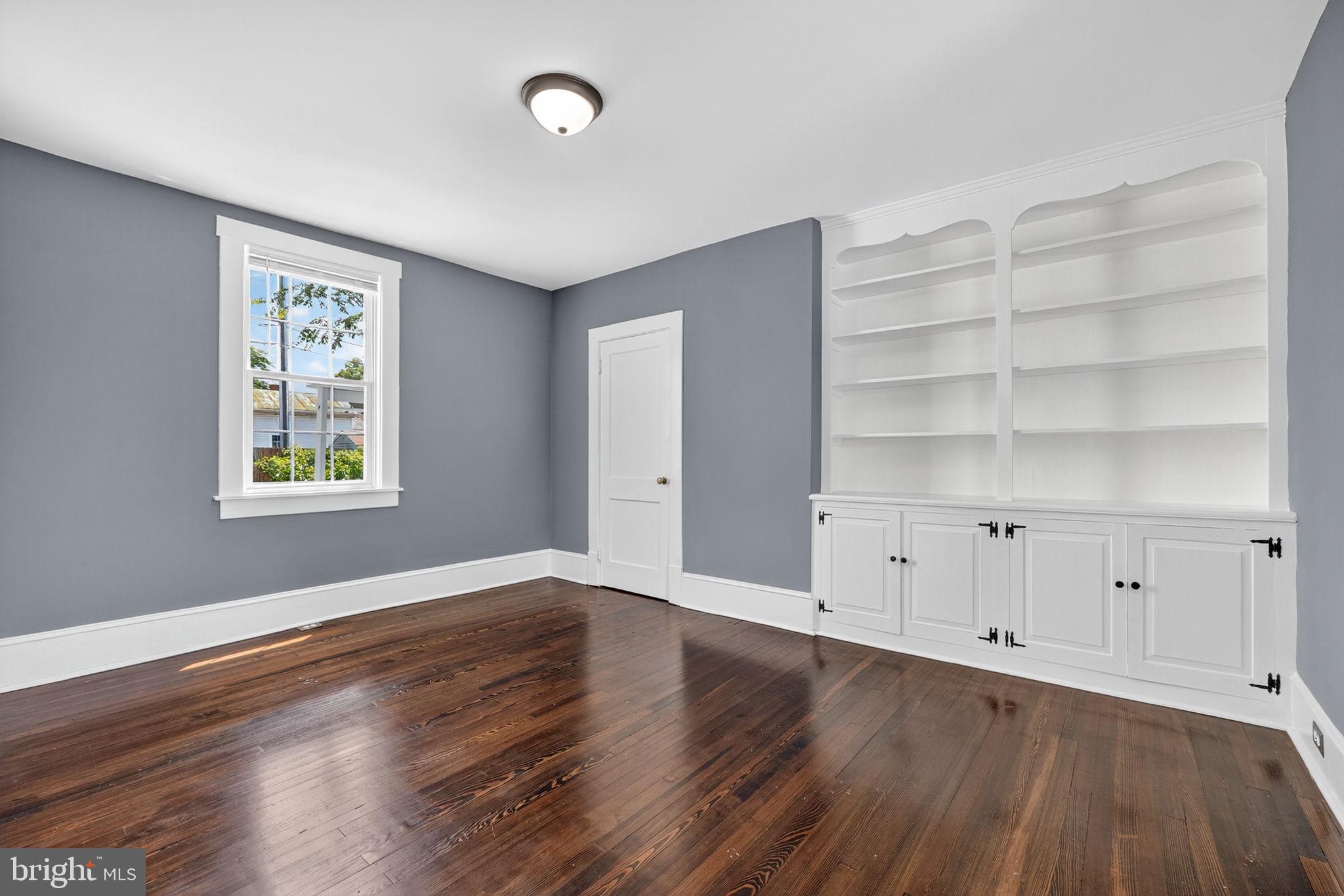 116 South Pleasant Valley Road Winchester, VA 22601 - Photo 15 of 40 Main level bedroom w/ closet & built-in shelves
