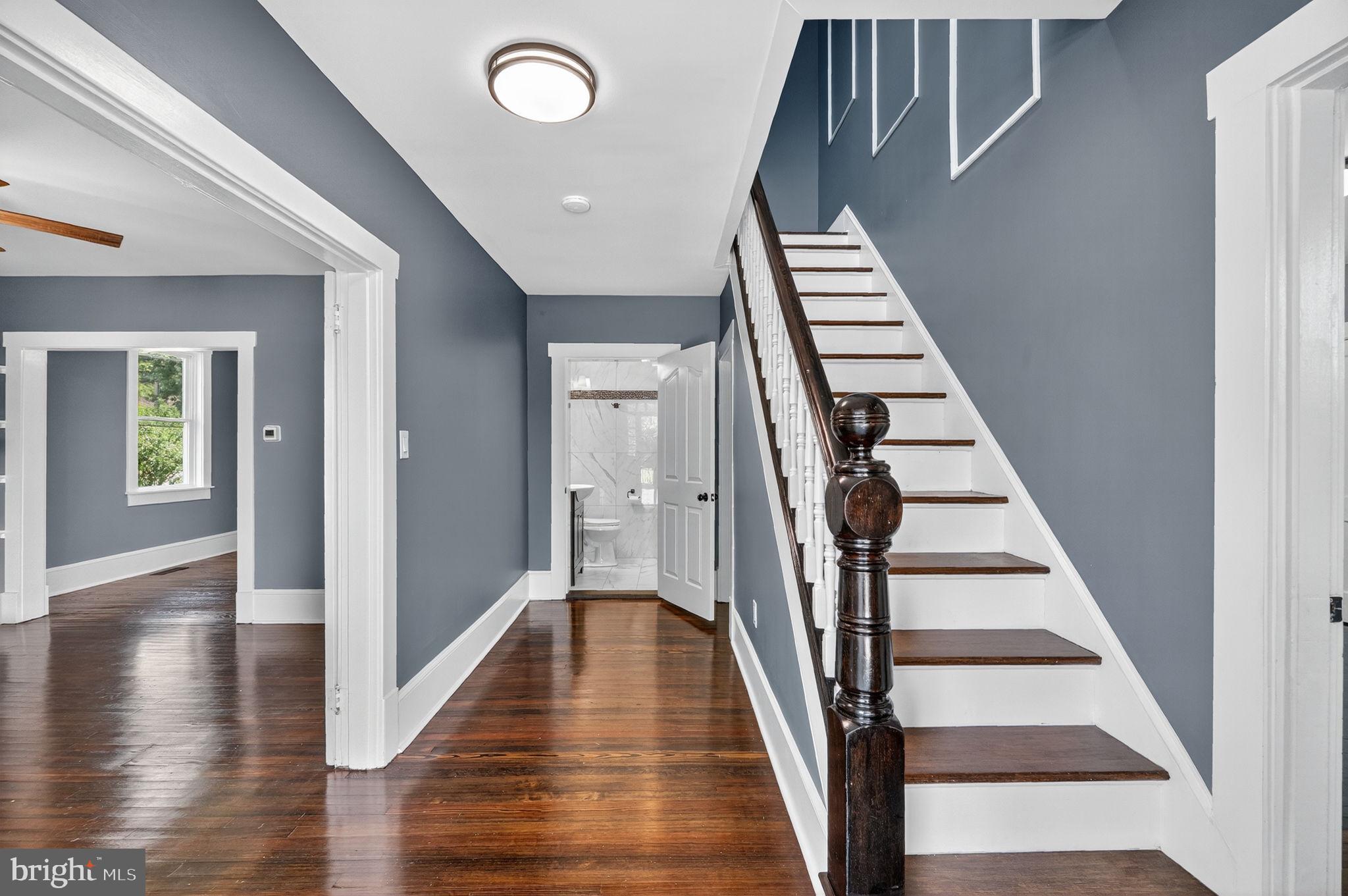 Foyer with newly refinished hardwood floors