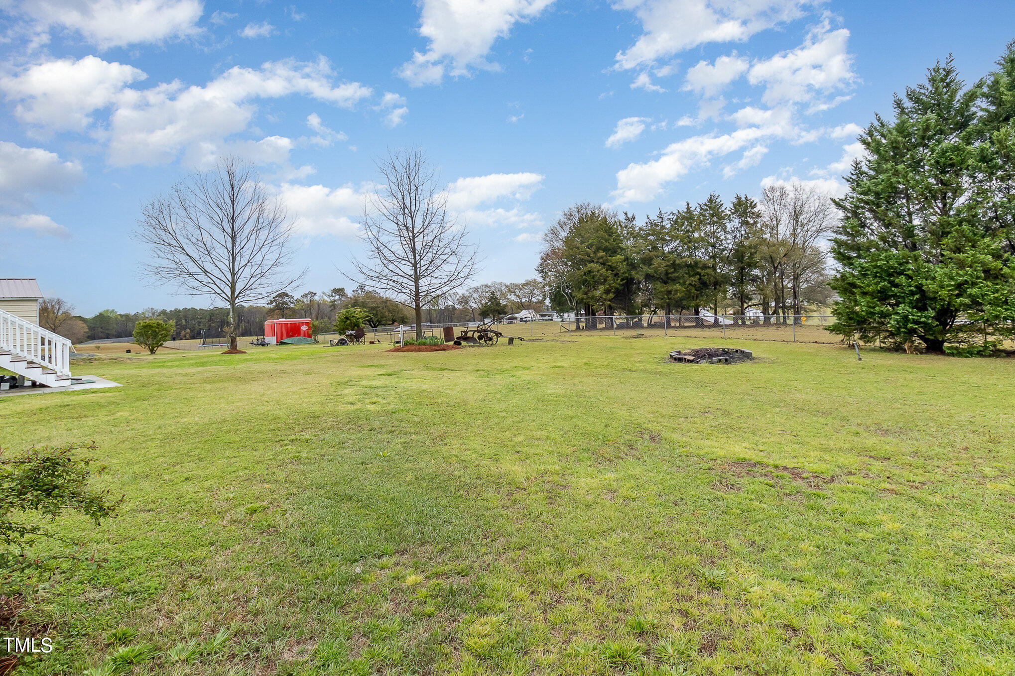20 Trail Ridge Drive Benson, NC 27504 - Photo 3 of 18 a view of a field with an trees in front of it