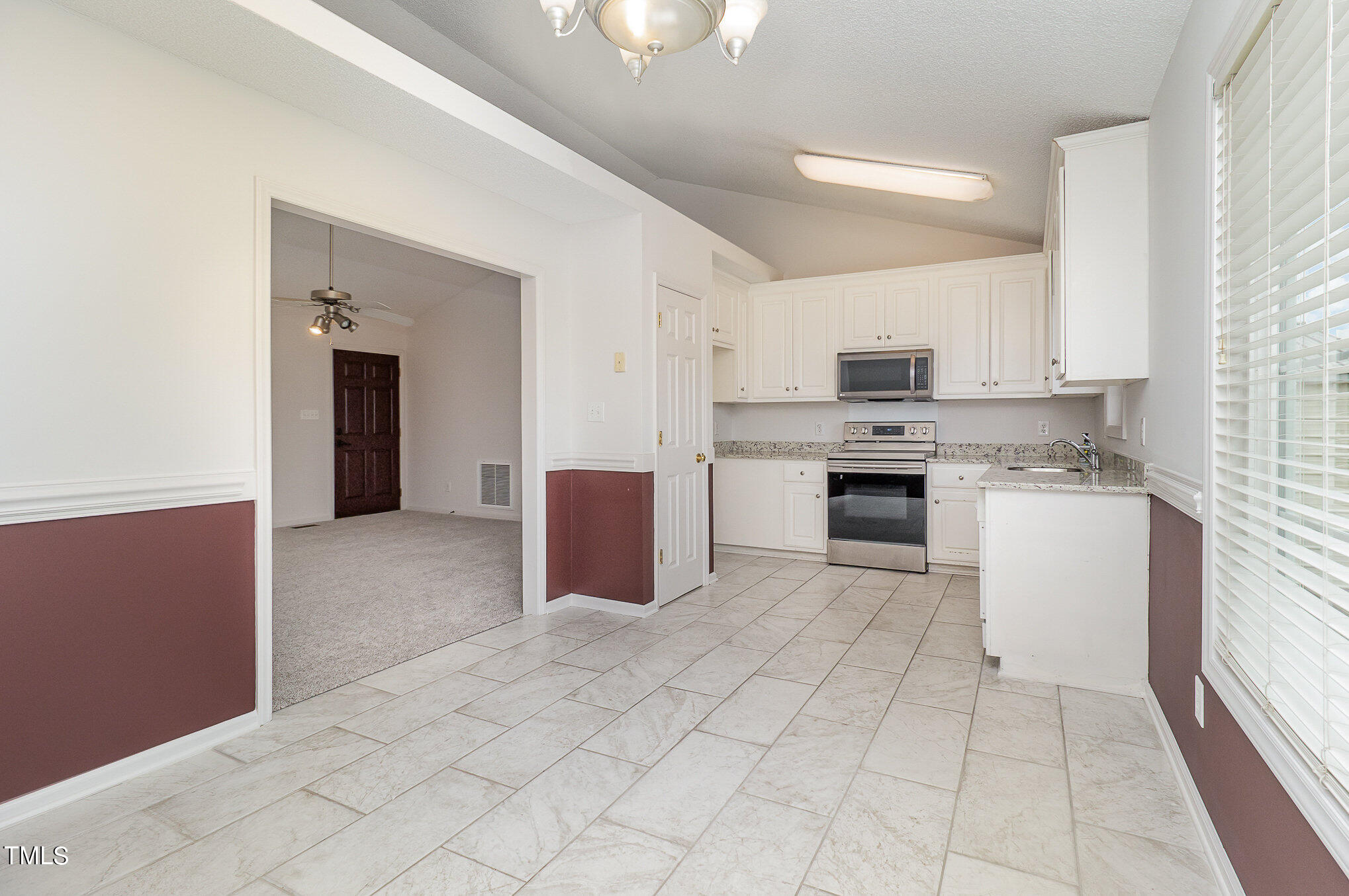 20 Trail Ridge Drive Benson, NC 27504 - Photo 8 of 18 a large white kitchen with cabinets