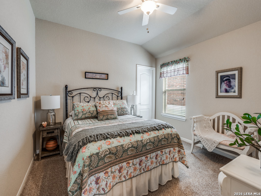 6050 Covers Schertz, TX 78108 - Photo 15 of 25 a bedroom with a bed and a chandelier