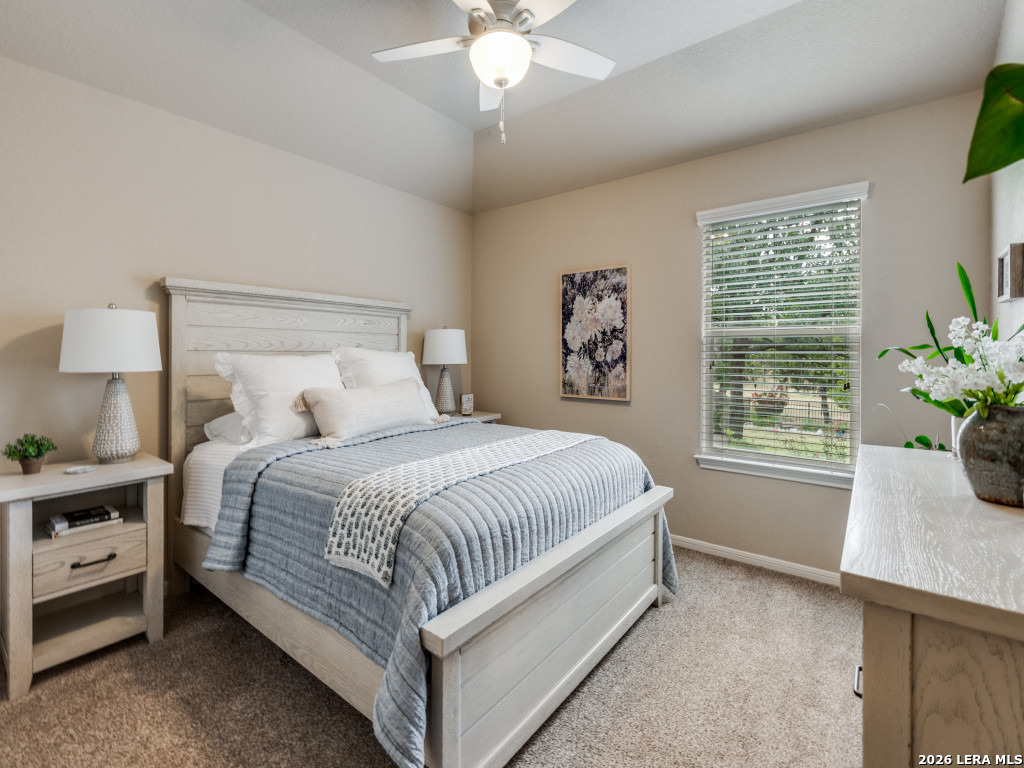 6050 Covers Schertz, TX 78108 - Photo 16 of 25 a spacious bedroom with a large bed and a window
