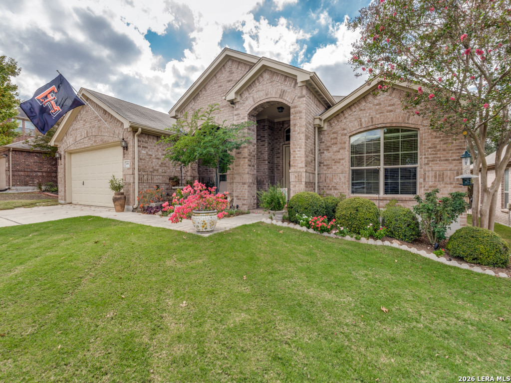 6050 Covers Schertz, TX 78108 - Photo 2 of 25 a front view of a house with a yard and garage
