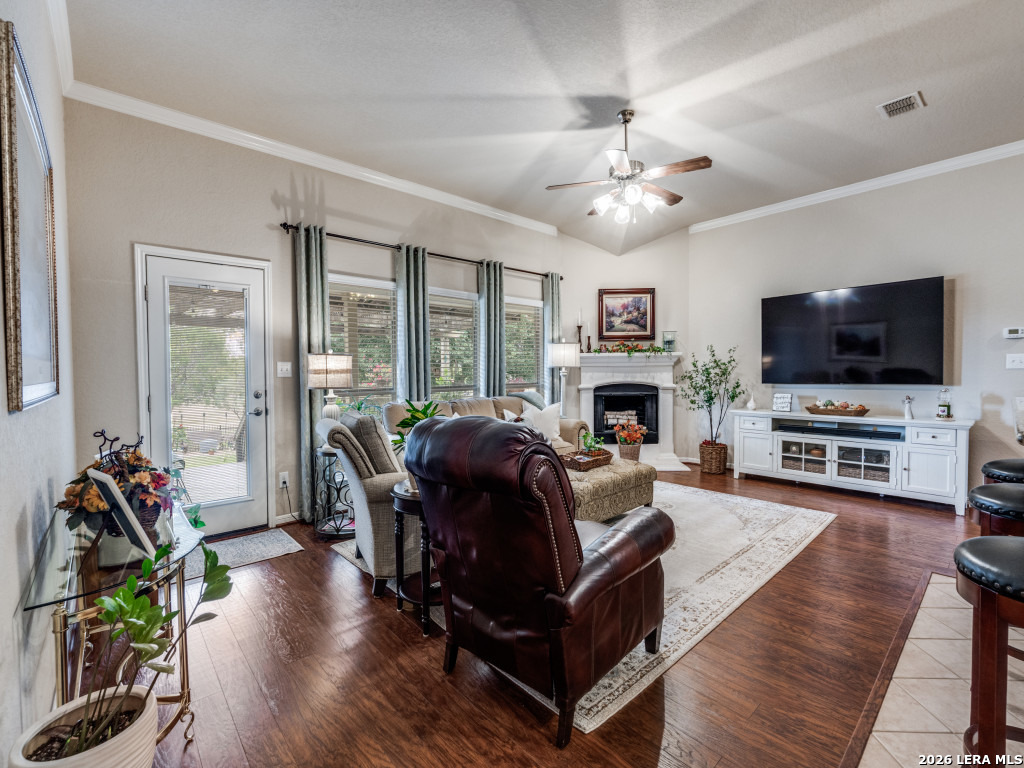 6050 Covers Schertz, TX 78108 - Photo 8 of 25 a living room with fireplace furniture and a flat screen tv