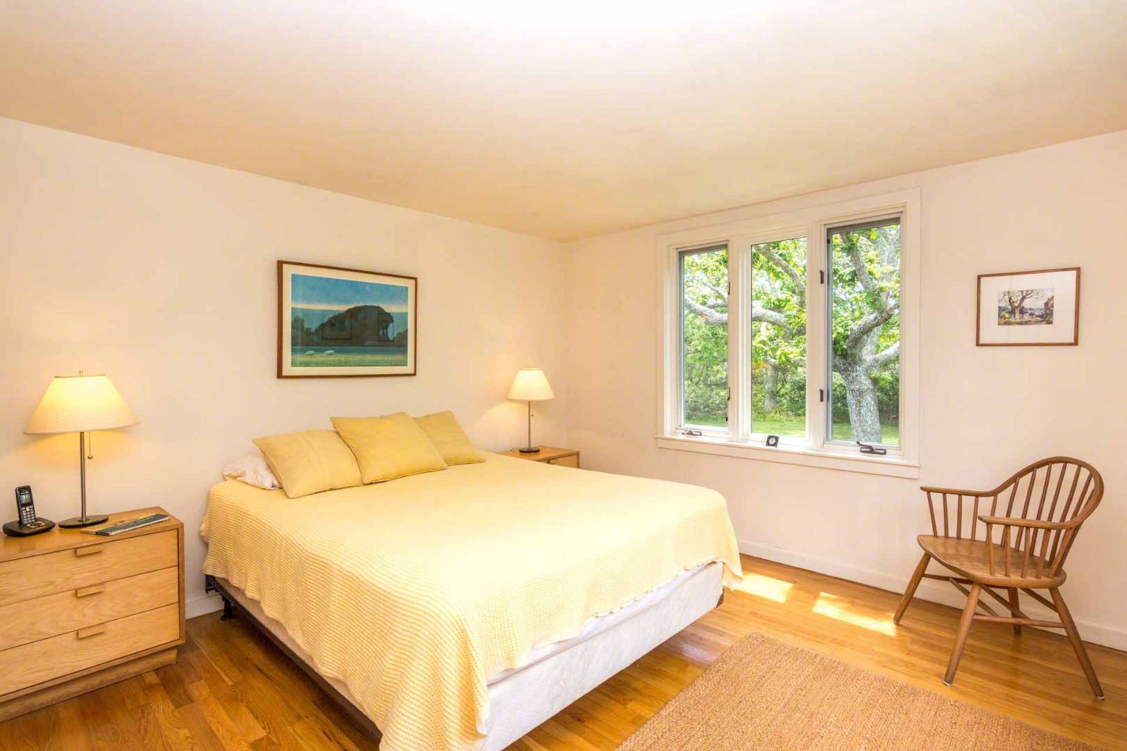 7 Black Point Road Chilmark, MA 02535 - Photo 17 of 44 a spacious bedroom with a bed and a lamp