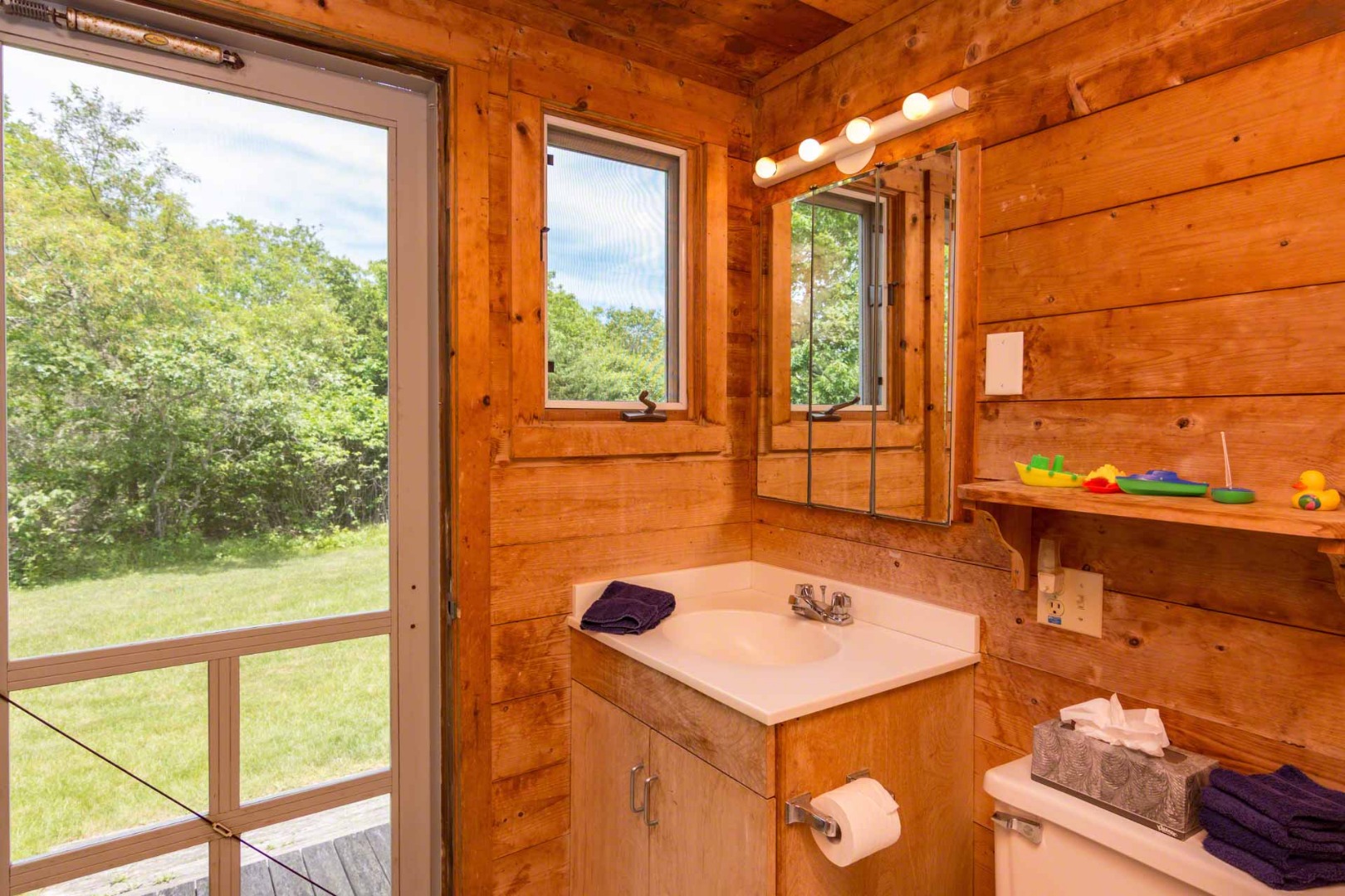 7 Black Point Road Chilmark, MA 02535 - Photo 25 of 44 a view of a room that has a bed and a window