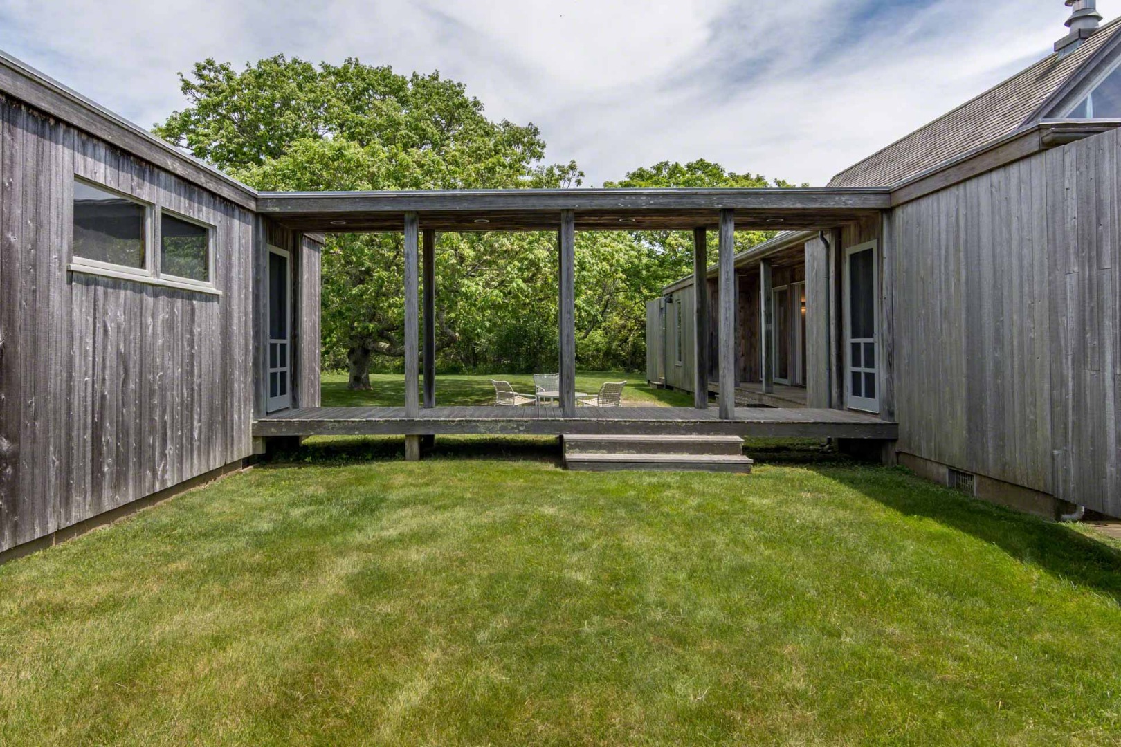 7 Black Point Road Chilmark, MA 02535 - Photo 42 of 44 a view of a house with backyard and porch