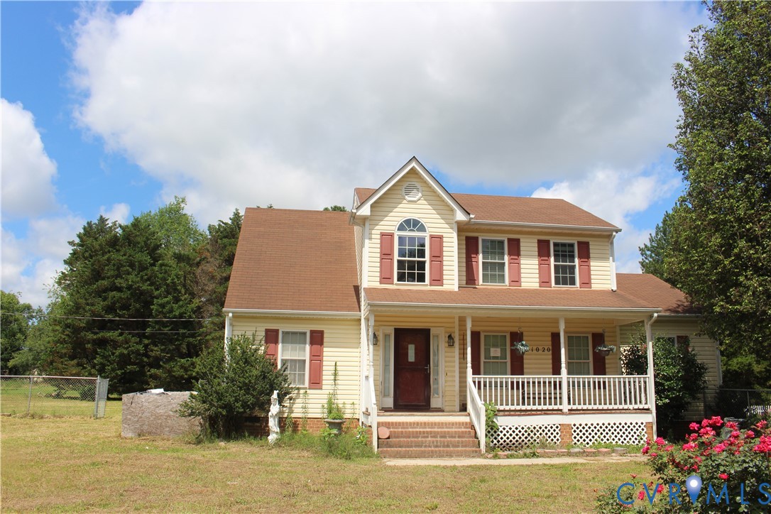a front view of a house with a porch