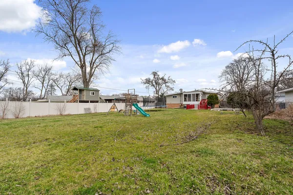 a view of outdoor space with deck and garden