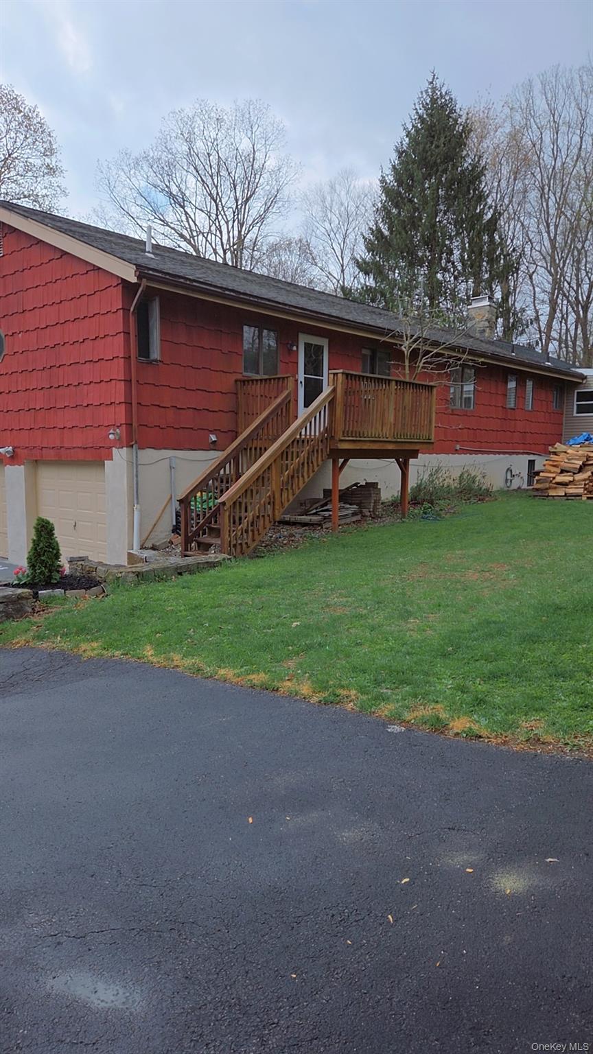 193 Overhill Road, Unit R Stormville, NY 12582 - Photo 2 of 10 a view of a house with backyard and sitting area