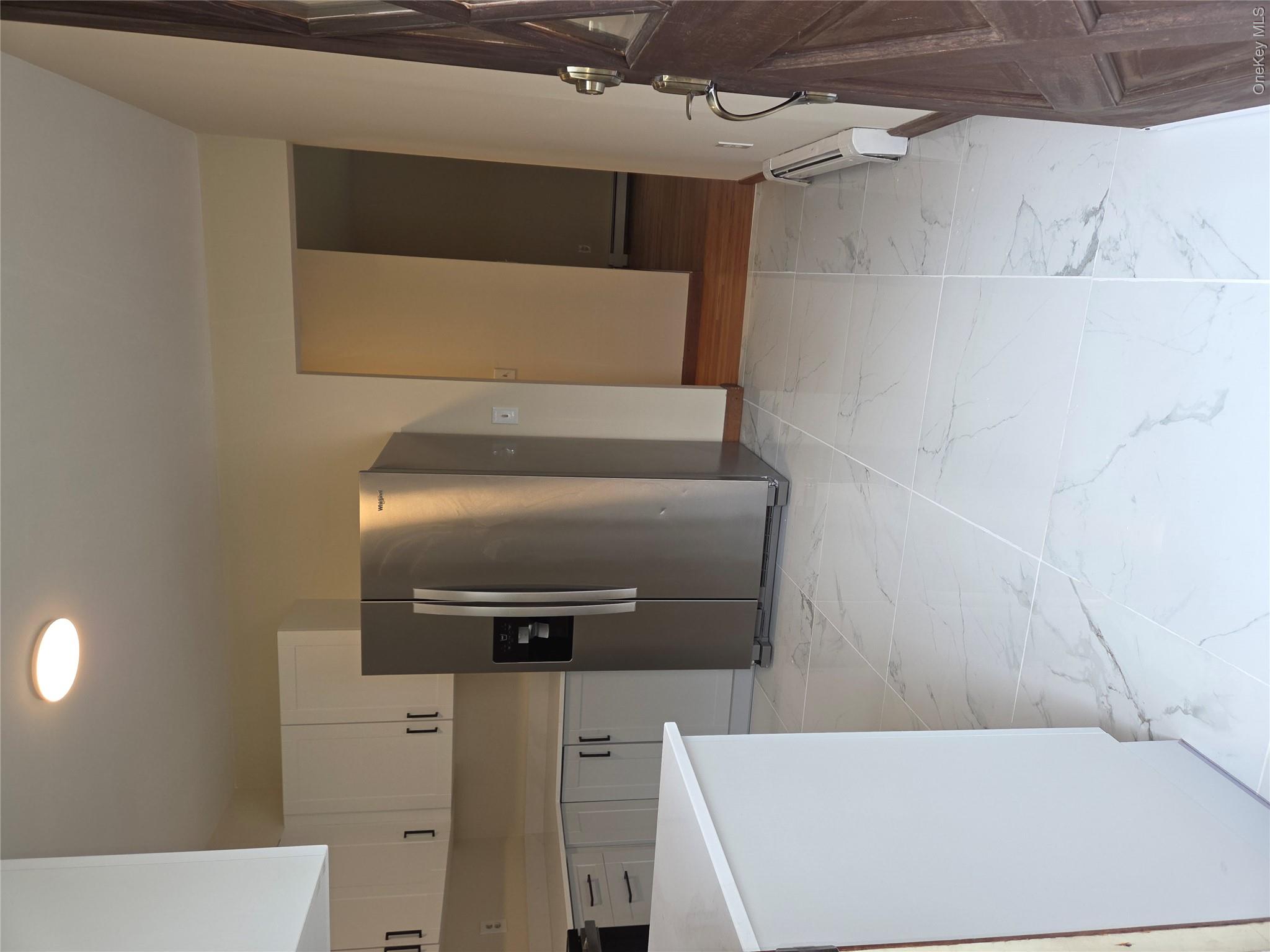 193 Overhill Road, Unit R Stormville, NY 12582 - Photo 3 of 10 a view of a kitchen with refrigerator and cabinets