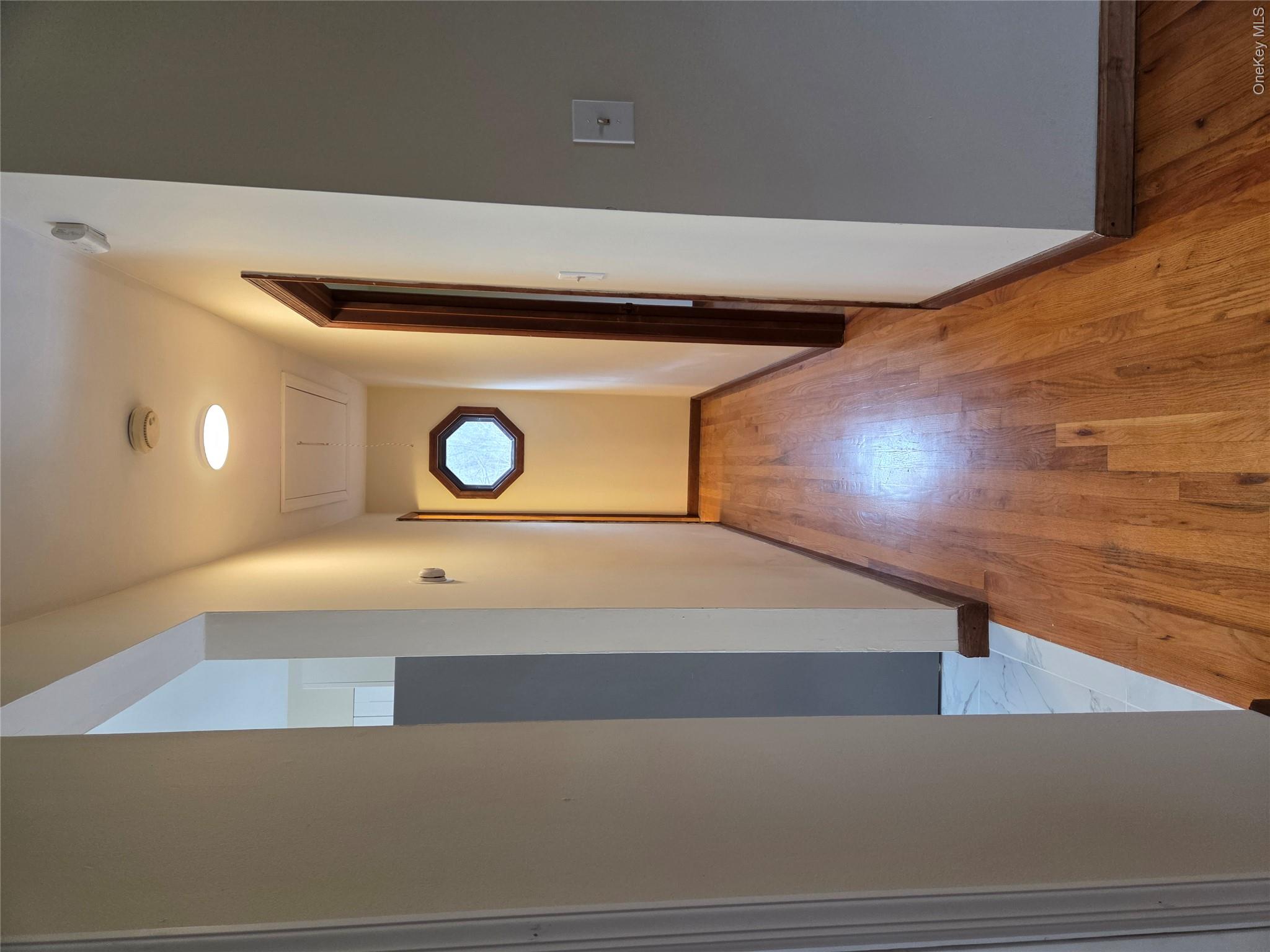 193 Overhill Road, Unit R Stormville, NY 12582 - Photo 7 of 10 a view of a hallway with wooden floor