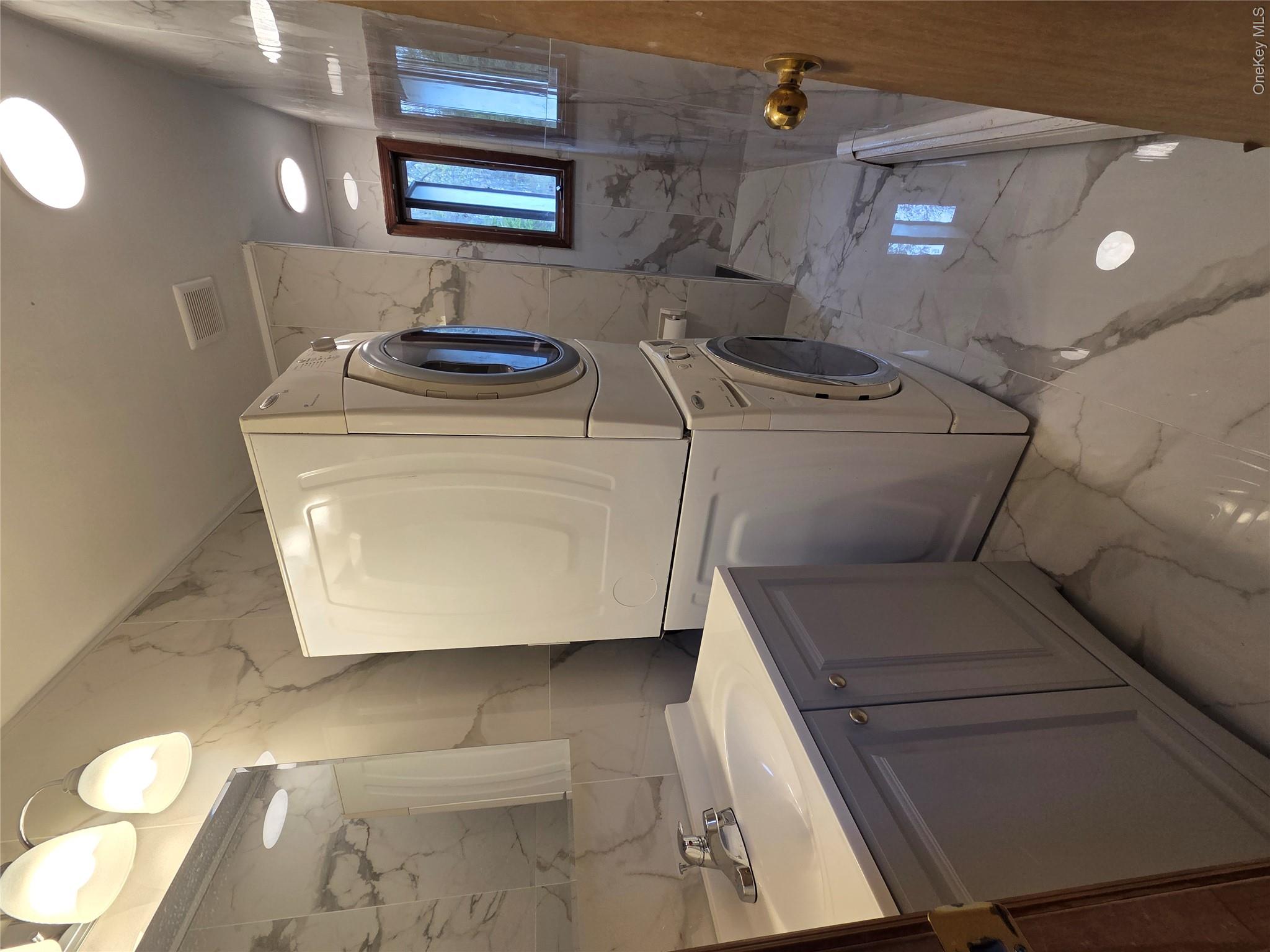 193 Overhill Road, Unit R Stormville, NY 12582 - Photo 10 of 10 a utility room with dryer and washer