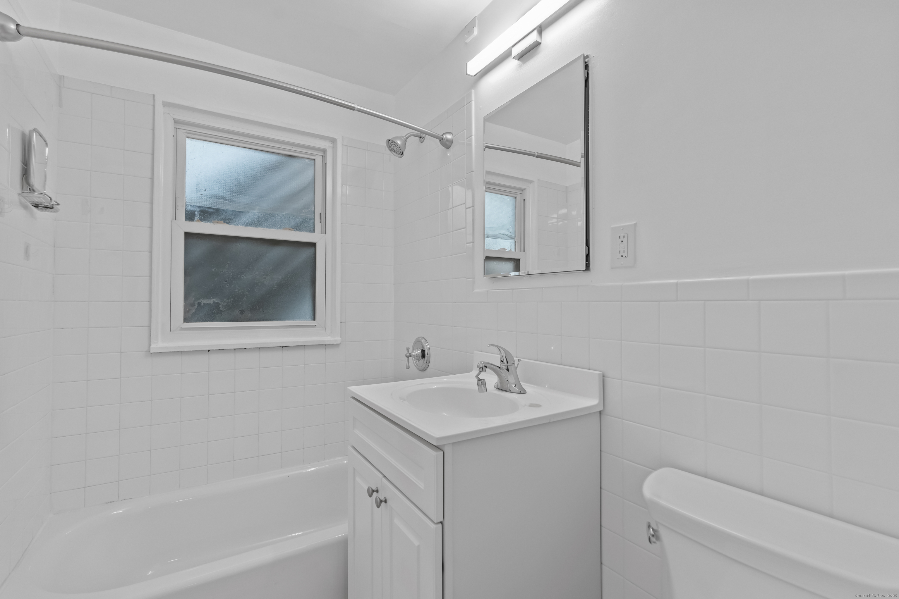 66 Blachley Road, Unit C Stamford, CT 06902 - Photo 13 of 26 a bathroom with a sink toilet and tub