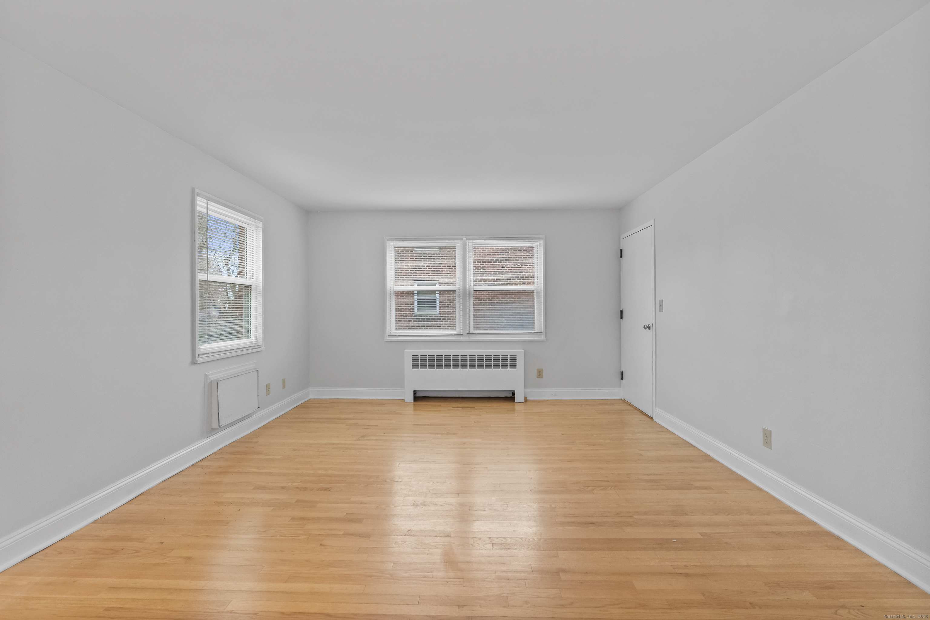 66 Blachley Road, Unit C Stamford, CT 06902 - Photo 6 of 26 a view of empty room with a window
