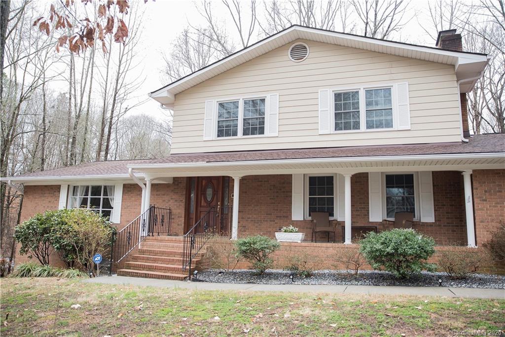 101 Sycamore Road, Unit 209 Salisbury, NC 28147 - Photo 2 of 33 a front view of a house with garden