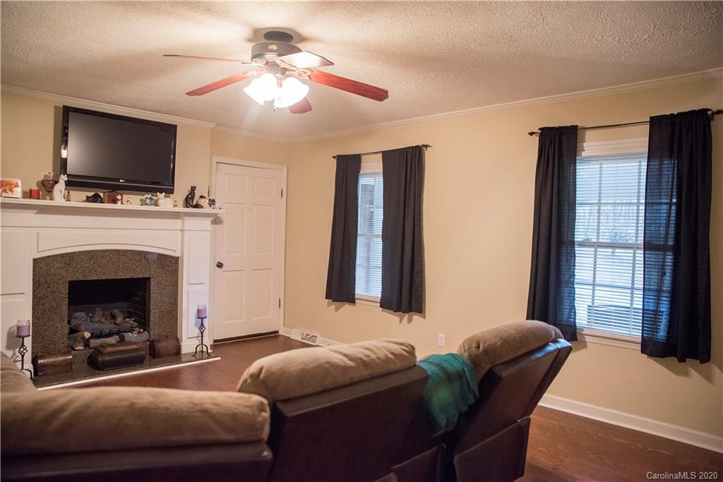 101 Sycamore Road, Unit 209 Salisbury, NC 28147 - Photo 14 of 33 a living room with furniture and a flat screen tv