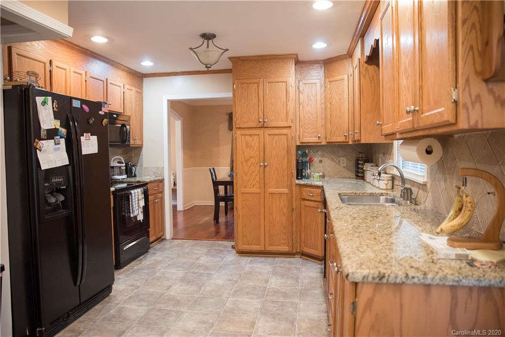 101 Sycamore Road, Unit 209 Salisbury, NC 28147 - Photo 15 of 33 a kitchen with refrigerator and window