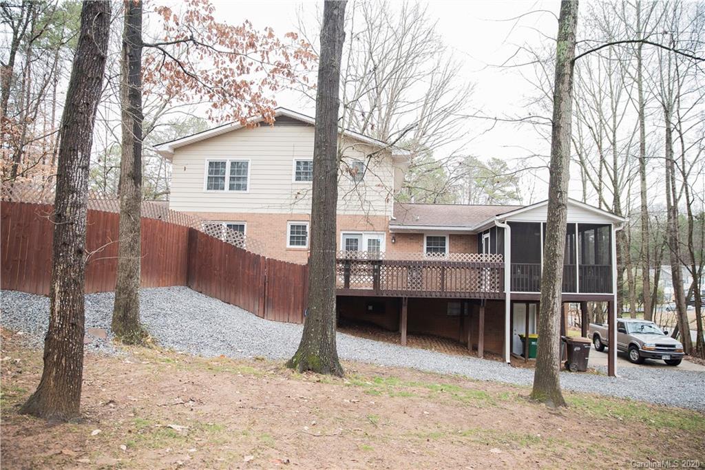 101 Sycamore Road, Unit 209 Salisbury, NC 28147 - Photo 3 of 33 a view of a house with a yard and large tree