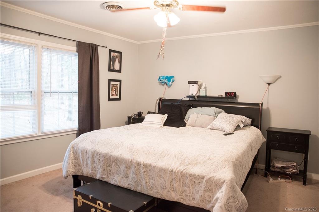 101 Sycamore Road, Unit 209 Salisbury, NC 28147 - Photo 23 of 33 a bedroom with a bed and a window