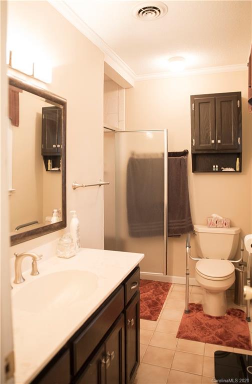 101 Sycamore Road, Unit 209 Salisbury, NC 28147 - Photo 24 of 33 a bathroom with a sink and a toilet