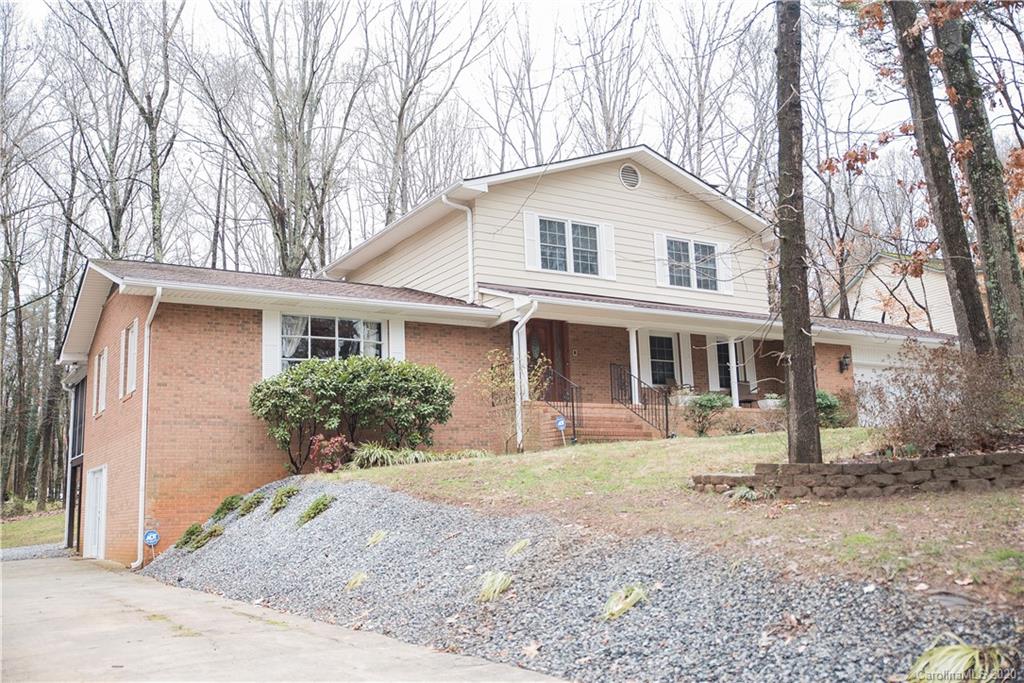 101 Sycamore Road, Unit 209 Salisbury, NC 28147 - Photo 33 of 33 a front view of a house with a yard and potted plants
