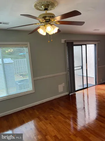 a white toilet sitting next to a small bathroom